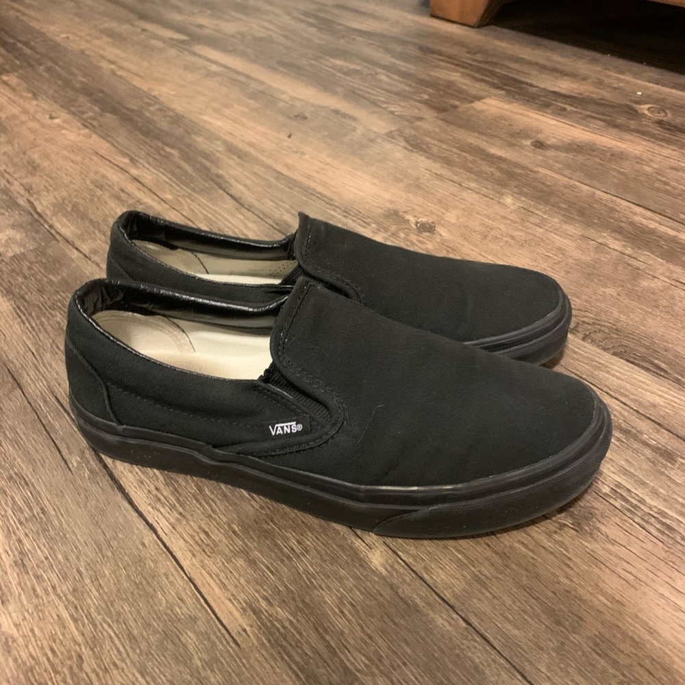 All black slip on vans